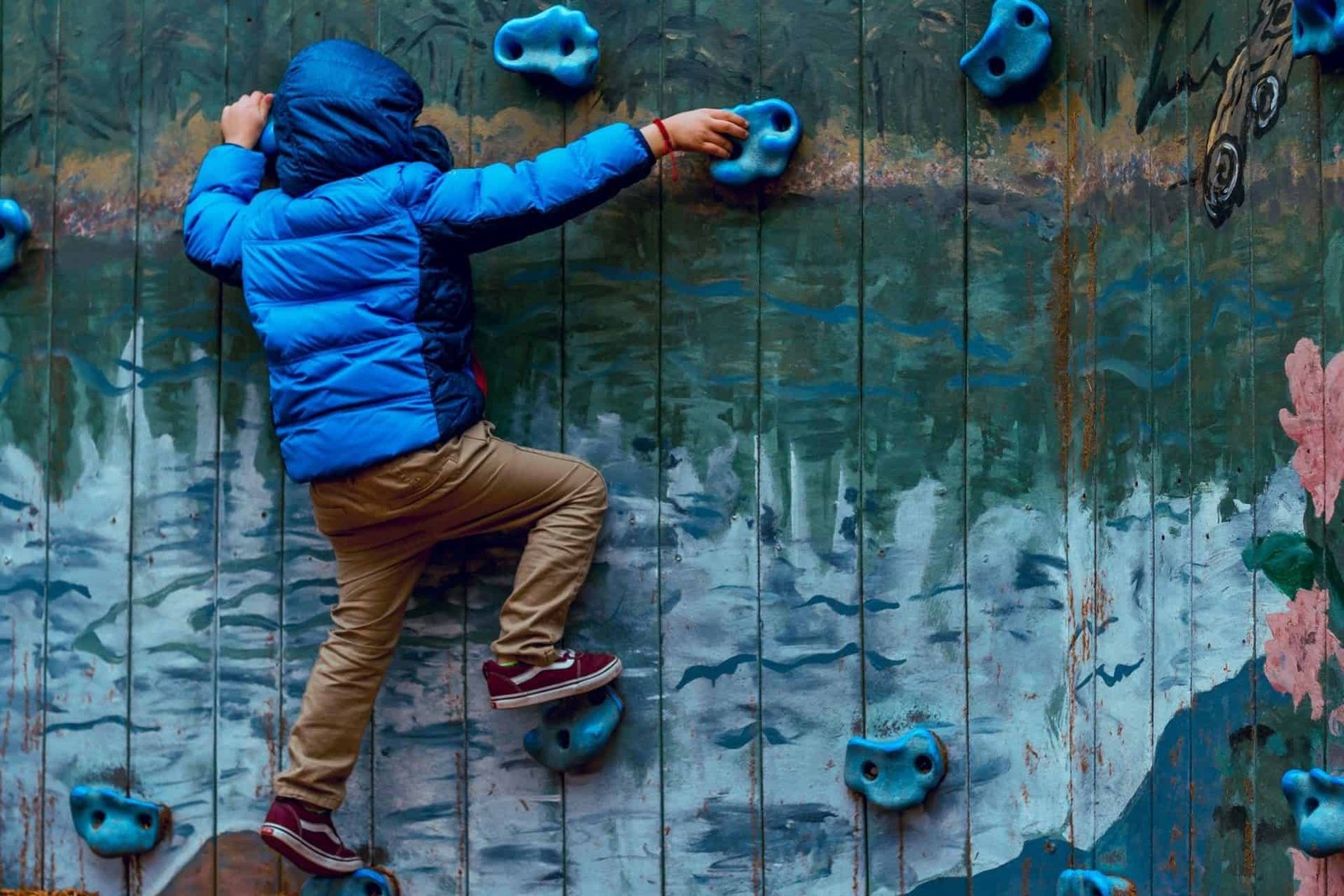 boy wall climbing